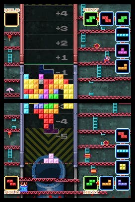 Capture d'écran de Tetris DS montrant un niveau de Tetris joué sur les deux écrans avec des échelles Donkey Kong autour