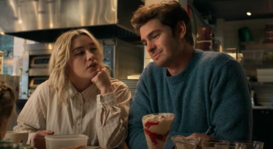 From left to right, Florence Pugh looking up at Andrew Garfield who is looking forward.
