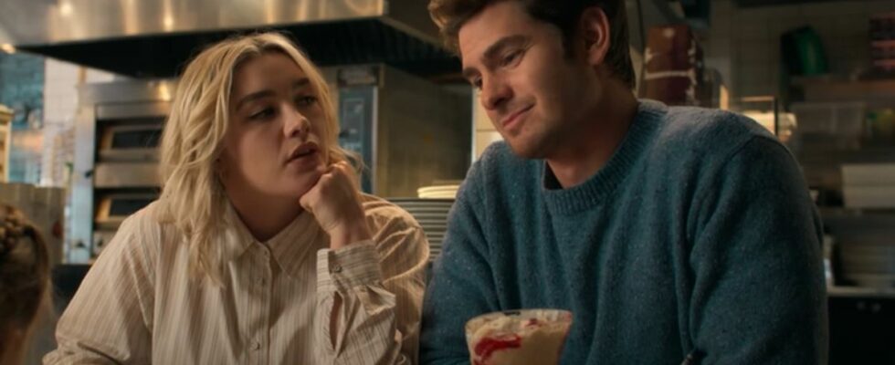 From left to right, Florence Pugh looking up at Andrew Garfield who is looking forward.