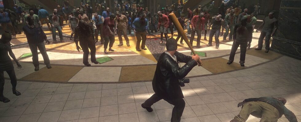 Dead Rising: Frank West wields a baseball bat as hordes of zombies advance on him in a shopping mall.