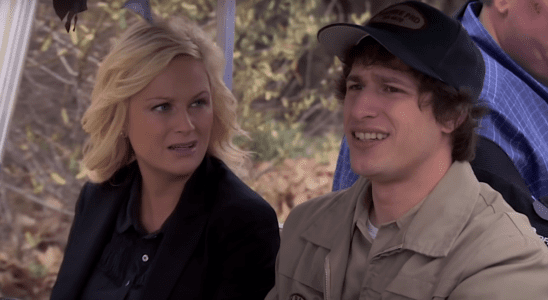 Andy Samberg and Amy Poehler riding in a golf cart in Parks and Recreation