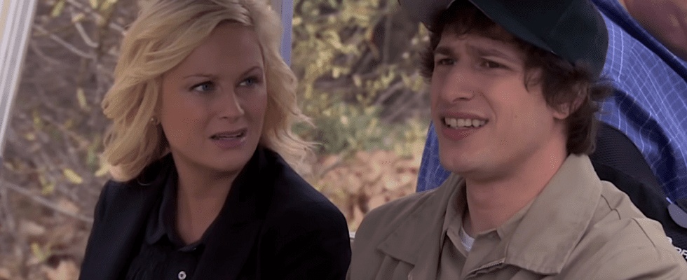 Andy Samberg and Amy Poehler riding in a golf cart in Parks and Recreation