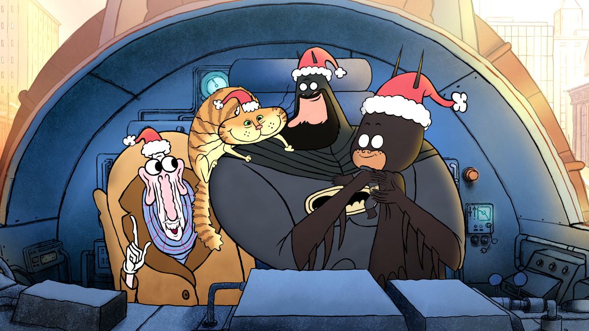 Batman, Damian Wayne dans un costume de Batman pour enfant, un chat et Alfred se rassemblent dans le cockpit du Batwing avec des chapeaux de Père Noël dans le joyeux petit Batman