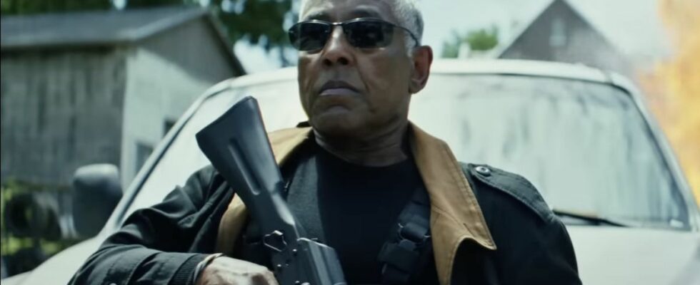 Giancarlo Esposito wearing sunglasses and holding rifle in Captain America: Brave New World