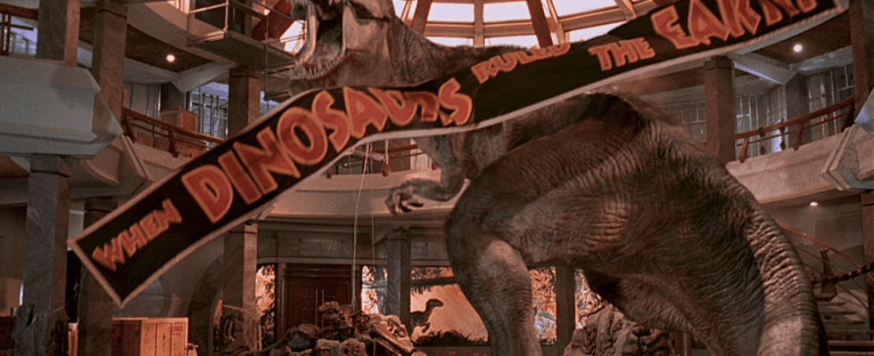 Roberta the T-Rex roars trumphantly, as a banner falls down, in Jurassic Park.