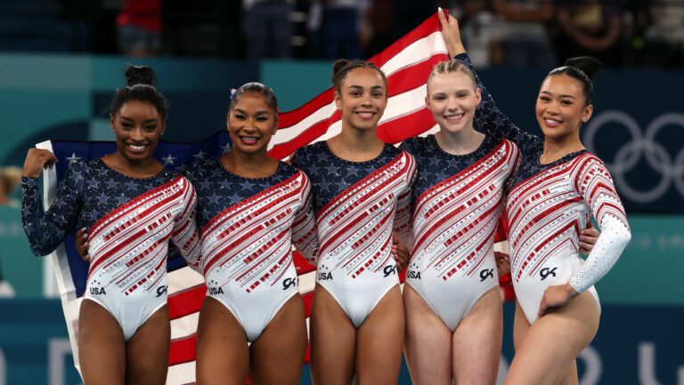 Simone Biles, Jordan Chiles, Hezly Rivera, Jade Carey and Sunisa Lee of the U.S. women's gymnastics team celebrate winning gold at the 2024 Olympics.