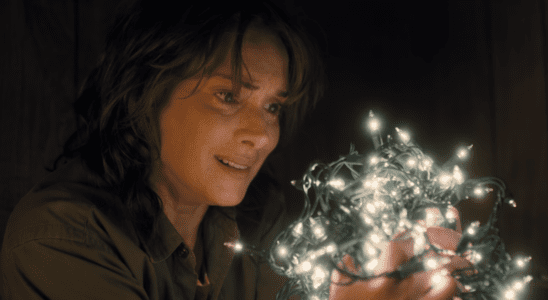 Winona Ryder with a bunch of christmas lights in Stranger Things Season 1