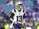 Le quart-arrière des New England Patriots, Nathan Rourke (13), s'échauffe avant un match de football de la NFL contre les Buffalo Bills à Orchard Park, New York, le 31 décembre 2023.
