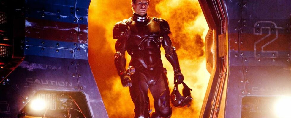 Charlie Hunnam heroically walking with fire raging behind him in Pacific Rim.