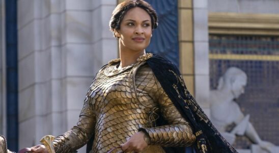 Cynthia Addai-Robinson riding horseback in gold armor in Rings of Power season 1