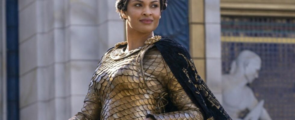 Cynthia Addai-Robinson riding horseback in gold armor in Rings of Power season 1