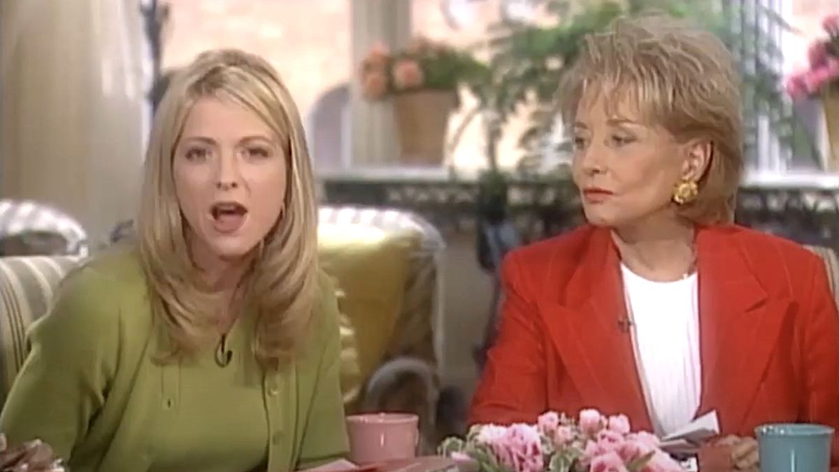 Debbie Matenopoulos beside Barbara Walters talking to camera during early season of The View