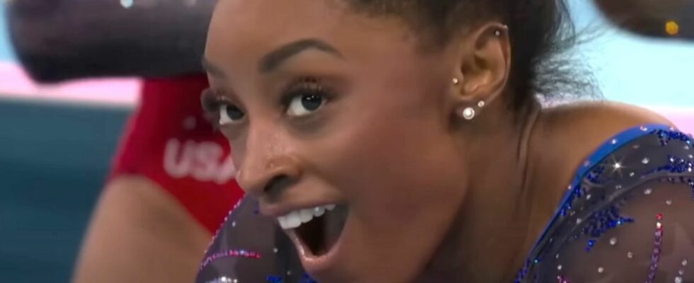 Simone Biles reacts to winning gold in the all-around competition at the Paris Olympics 2024.