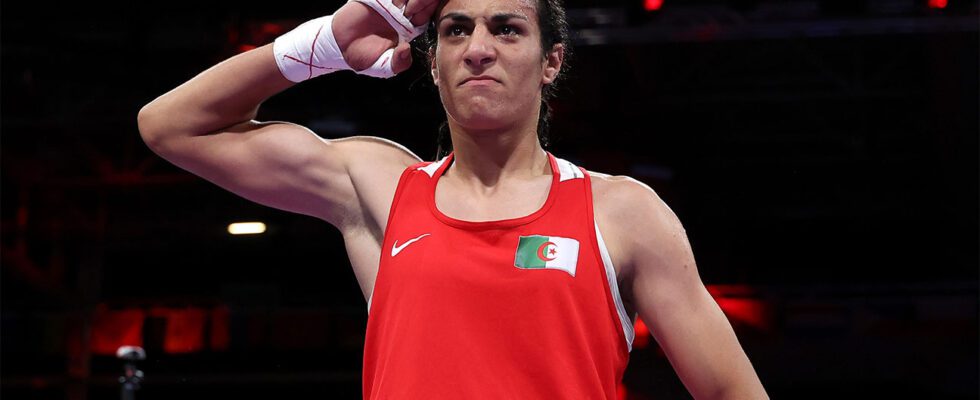 Imane Khelif celebrates victory against Anna Luca Hamori of Team Hungary at 2024 Olympics.