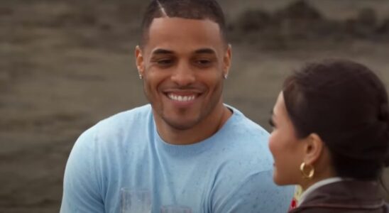 Grant Ellis smiles at Jenn Tran during their one-on-one date on a beach on The Bachelorette Season 21.