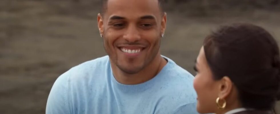 Grant Ellis smiles at Jenn Tran during their one-on-one date on a beach on The Bachelorette Season 21.