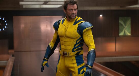 Hugh Jackman stands angrily in the TVA in Deadpool and Wolverine.