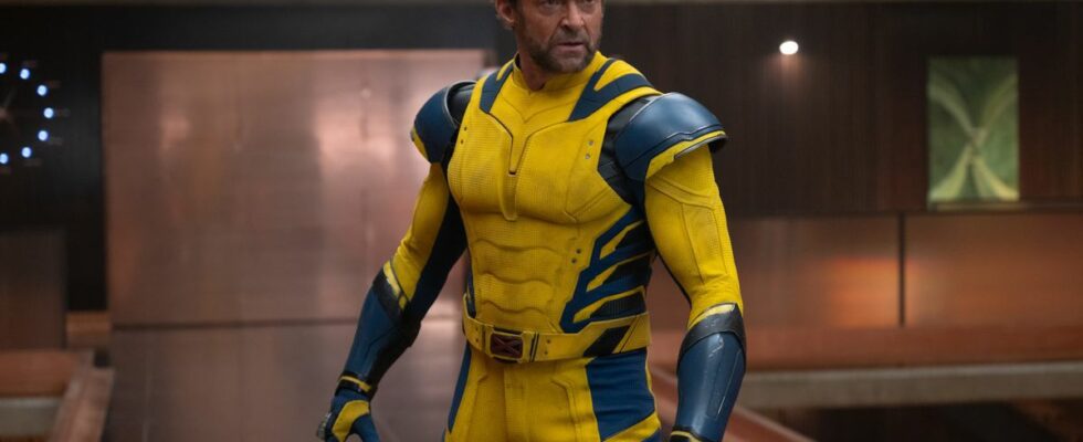 Hugh Jackman stands angrily in the TVA in Deadpool and Wolverine.