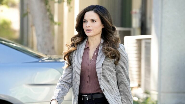 Katrina Law's Jessica Knight walking away from silver car in NCIS