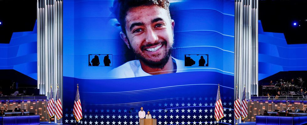 An image of Hersh Goldberg-Polin is displayed as his parents Jon Polin and Rachel Goldberg speak on stage during the third day of the 2024 DNC.