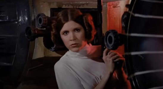 Carrie Fisher's Leia holding blaster at the beginning of A New Hope