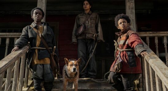 June (Halle Berry), Nolan (Percy Daggs IV) and Sam (Anthony B. Jenkins) with their dog on a porch in Never Let Go