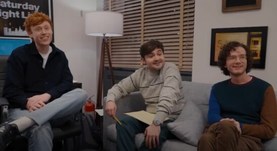 From left to right: Ben Marshall, John Higgins and Martin Herlihy smiling while sitting in their office on SNL.