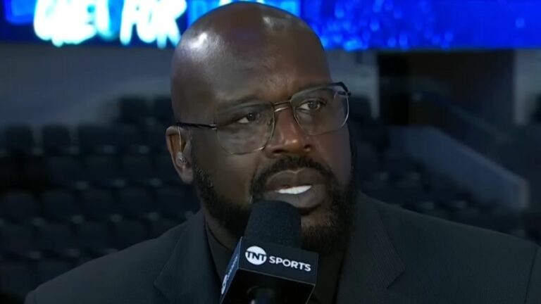 Shaquille O'Neal talking about the NBA with a microphone in his hands