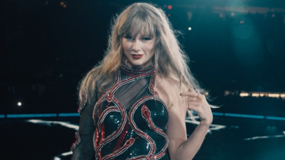 Taylor Swift looks into the camera while singing &quot;Delicate&quot; during the Reputation Era of her Eras Tour on the concert film Taylor Swift: The Eras Tour (Taylor&#039;s Version).