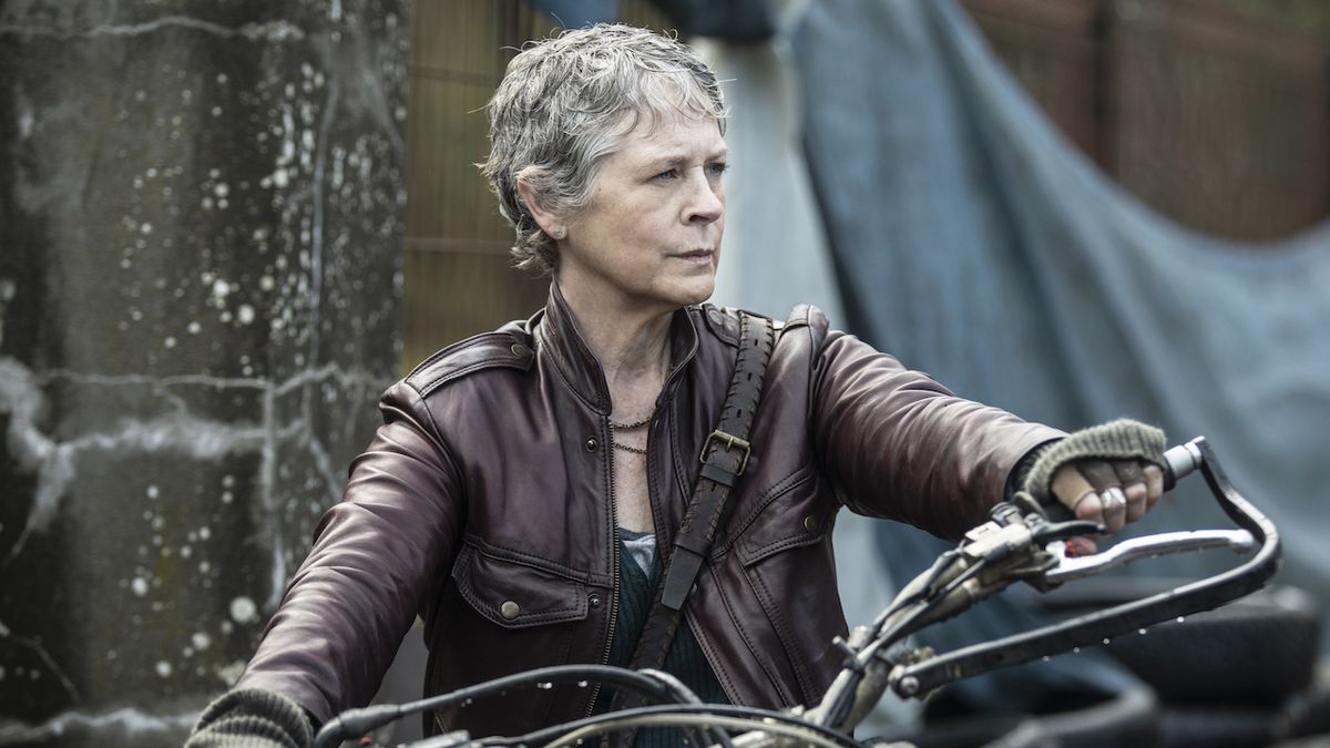 Carol sitting on motorcycle in The Walking Dead: Daryl Dixon - The Book of Darol