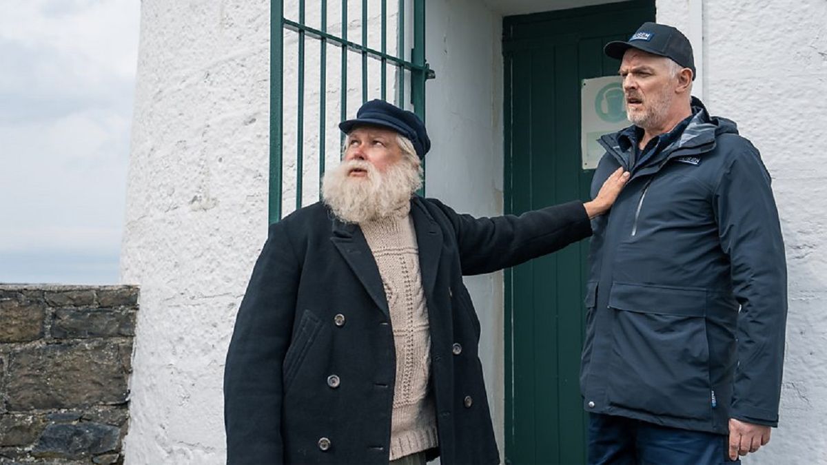 Lighthouse keeper Brennan (Conleth Hill) manhandles crime scene cleaner Wicky (Greg Davies) in season 3 of black comedy The Cleaner