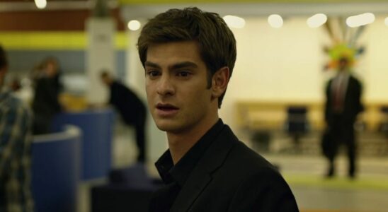 Andrew Garfield as Eduardo Saverin in The Social Network looking hurt as he walks out of the Facebook office.