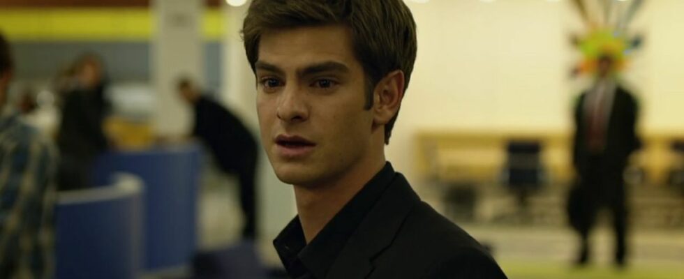 Andrew Garfield as Eduardo Saverin in The Social Network looking hurt as he walks out of the Facebook office.