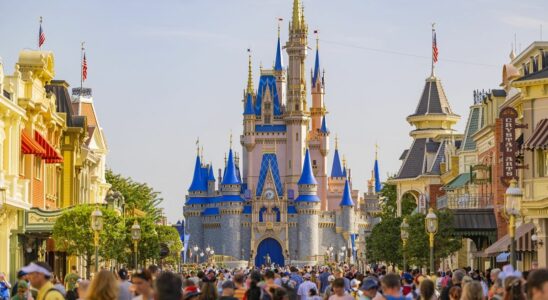 Cinderella Castle in the distance of Main Street U.S.A with crowds