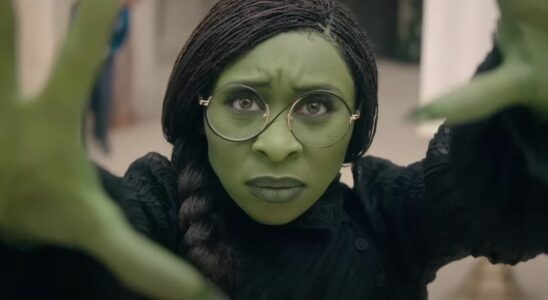 Cynthia Erivo's Elphaba holding up her hands in Wicked: Part One