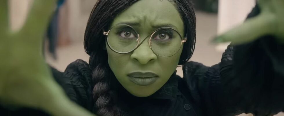 Cynthia Erivo's Elphaba holding up her hands in Wicked: Part One