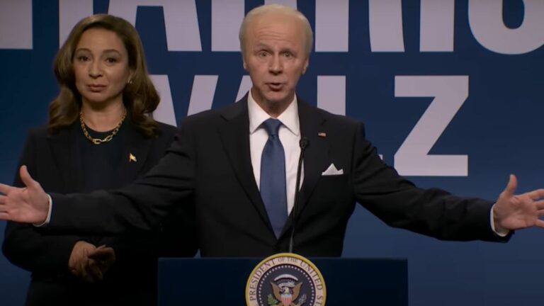 Dana Carvey portrays Joe Biden on the Saturday Night Live Season 50 premiere, as Maya Rudolph (as Kamala Harris) stands behind him.