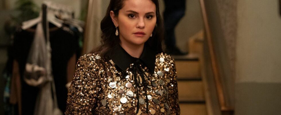 Selena Gomez stands with a look of concern in a gold and black sequin dress in Only Murders in the Building.