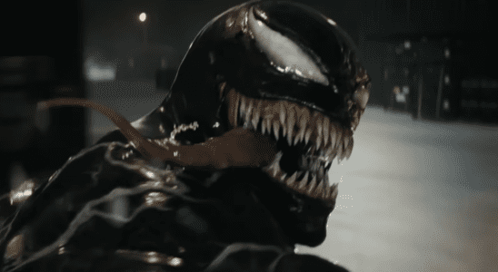 Venom looking back with his tongue hanging out while on a motorcyle in Venom: The Last Dance trailer