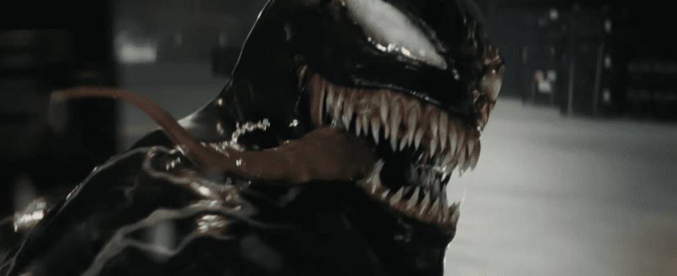 Venom looking back with his tongue hanging out while on a motorcyle in Venom: The Last Dance trailer